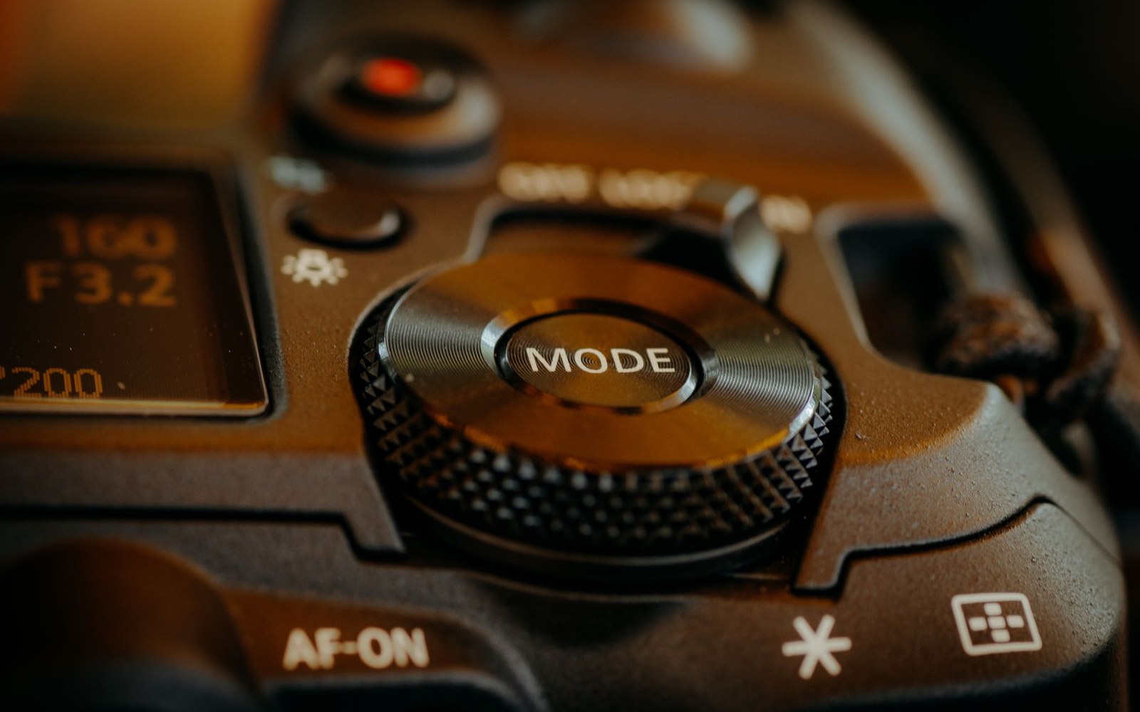 Close-up of a dslr camera's mode dial, af-on button and iso display